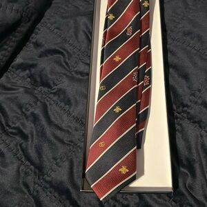 Gucci branded tie.
